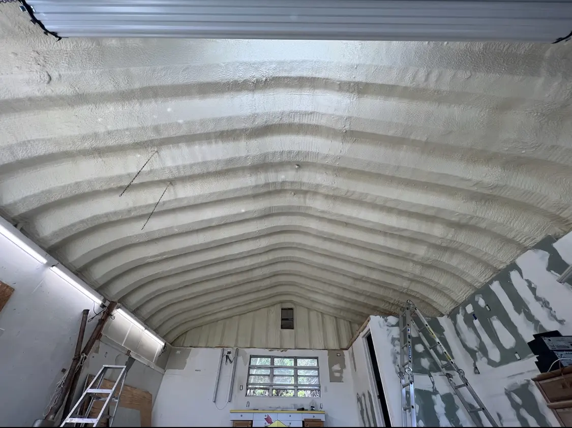 Spray polyurethane foam applied to the underside of a metal roof deck in Breaux Bridge
